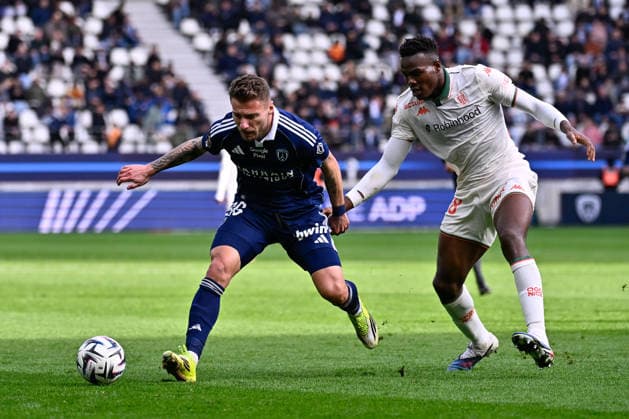 FOOTBALL : Paris FC vs Nice - Ligue 1 - 01 03 2026 Ciro Immobile ( 36 - PFC ) and Kojo Peprah Oppong ( 37 - Nice ) during the Ligue 1 match between Paris FC and OGC Nice at Stade Jean Bouin on March 01, 2026 in Paris, France. ( Photo by Federico Pestellini PsnewZ ) - ParisFrance  Copyright: xFedericoxPestelinix