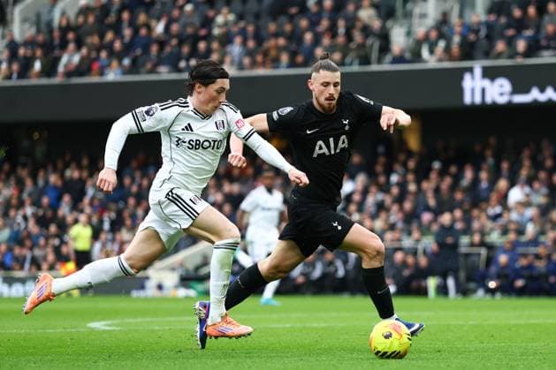 Harry Wilson of Fulham under pressure from Radu Dragusin of Tottenham Hotspur Fulham v Tottenham Hotspur, Premier League, Football, Craven Cottage, London, UK - 01 Mar 2026London Craven Cottage United Kingdom EDITORIAL USE ONLY No use with unauthorised audio, video, data, fixture lists, club league logos or live services. Online in-match use limited to 120 images, no video emulation. No use in betting, games or single club league player publications. Copyright: xSimonxDael Shutterstockx 16708827ct