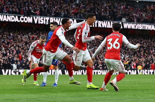 William Saliba of Arsenal celebrates scoring the opening goal with team-mates Arsenal v Chelsea, Premier League, Football, Emirates Stadium, London, UK - 01 Mar 2026London Emirates Stadium United Kingdom EDITORIAL USE ONLY No use with unauthorised audio, video, data, fixture lists, club league logos or live services. Online in-match use limited to 120 images, no video emulation. No use in betting, games or single club league player publications. Copyright: xMichaelxZemanek Shutterstockx 16708844t
