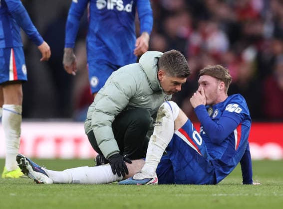 London, England, 1st March 2026. Cole Palmer of Chelsea injured attended to by the physio during the Arsenal vs Chelsea Premier League match at the Emirates Stadium, London. Picture credit should read: David Klein Sportimage EDITORIAL USE ONLY. No use with unauthorised audio, video, data, fixture lists, club league logos or live services. Online in-match use limited to 120 images, no video emulation. No use in betting, games or single club league player publications. SPI_039_DK_Arsenal_Chelsea SPI-4568-0039