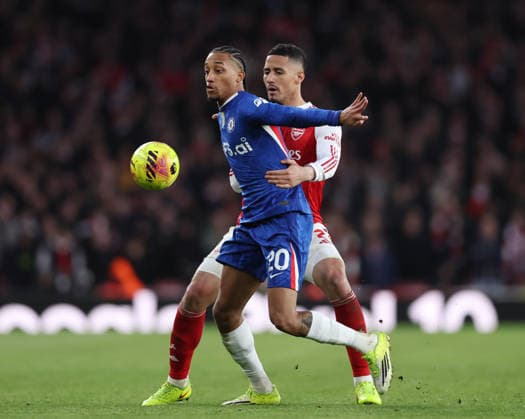 London, England, 1st March 2026. Joao Pedro of Chelsea tackled by William Saliba of Arsenal during the Arsenal vs Chelsea Premier League match at the Emirates Stadium, London. Picture credit should read: David Klein Sportimage EDITORIAL USE ONLY. No use with unauthorised audio, video, data, fixture lists, club league logos or live services. Online in-match use limited to 120 images, no video emulation. No use in betting, games or single club league player publications. SPI_069_DK_Arsenal_Chelsea SPI-4568-0069