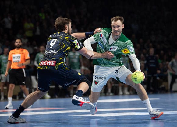 Handball, Herren, Saison 2025 2026, DAIKIN Handball-Bundesliga (23. Spieltag), Füchse Berlin - Rhein-Neckar Löwen, v.l. Steven Plucnar Jacobsen (Löwen), Mathias Gidsel (Füchse Berlin), 01.03.2026, Copyright: xSebastianxRäppold MatthiasxKochx