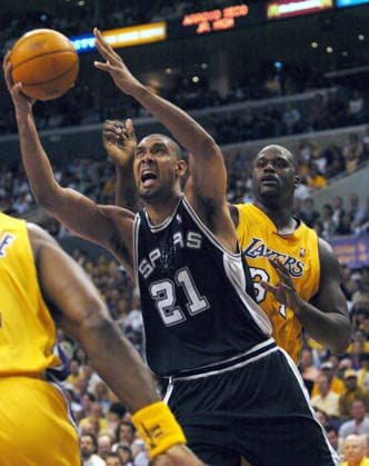 May 15, 2004; Los Angeles, CA, USA; Spurs Tim Duncan drives past Los Angeles Lakers Shaquille O Neal in the first half in Game 6 of the Western Conference semifinals at the Staples Center. The Lakers beat the Spurs 88-76. Los Angeles Texas U.S. Copyright: xKinxManxHuix