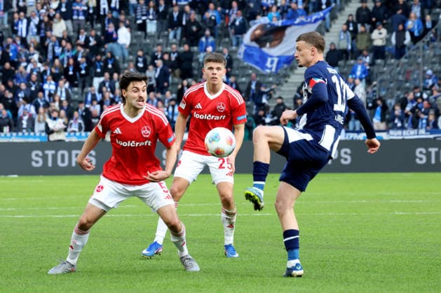 DEU, DFL, 2. FBL, Hertha BSC vs. 1.FC Nuernberg, 01.03.2026, Berliner Olympiastadion, Berlin, DEU, DFL, 2. FBL, Hertha BSC vs. 1.FC Nuernberg, im Bild Michael Cuisance (Hertha BSC Berlin 10), TOM BAACK (1.FC Nuernberg 5), FINN BECKER (1.FC Nuernberg 25) DFL - regulations prohibit any use of Photographs as image sequences and or quasi-video