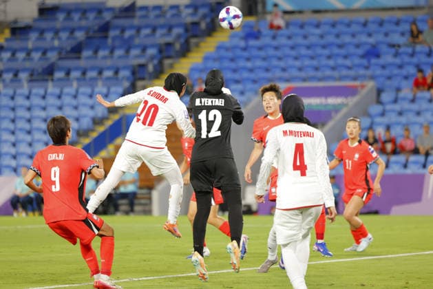 Goalkeeper Maryam Yektaei (12 IR Iran) and Sara Didar (20 IR Iran) challenge for the same ball during the Womens Asian Cup match between Korea Republic and Islamic Republic of Iran at the Gold Coast Stadium in Robina, Australia Copyright: xMatthewxStarlingx xSPPx Sportspressphoto_SPR99845