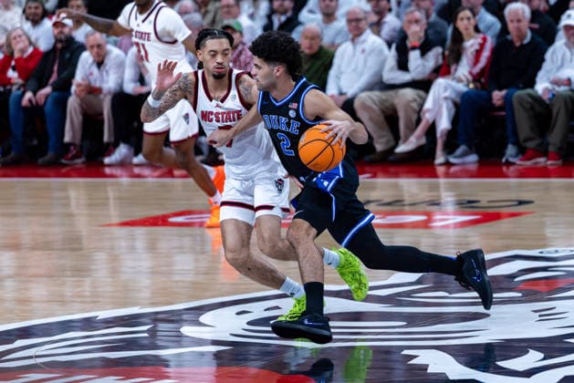 March 2, 2026, Raleigh, North Carolina, USA: Duke Blue Devils guard CAYDEN BOOZER (2) moves the ball down court against NC State Wolfpack guard ALYN BREED (7) during the first half of the NCAA, College League, USA ACC menÃ¢â‚¬â ¢s basketball game between the Duke Blue Devils and the NC State Wolfpack at the Lenovo Center in Raleigh, North Carolina. Raleigh USA - ZUMAa220 20260302_znp_a220_040 Copyright: xIsraelxAntax