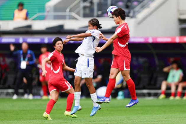 Solikha Khusniddino of Uzbekistan and Ri Hye-Gyong of DPR Korea challenge for the ball during the AFC Womens Asian Cup 2026 match between Korea DPR Women and Uzbekistan Women at Western Sydney Stadium, Sydney, Australia on 3 March 2026. Copyright: xPeterxDovganx 44600026