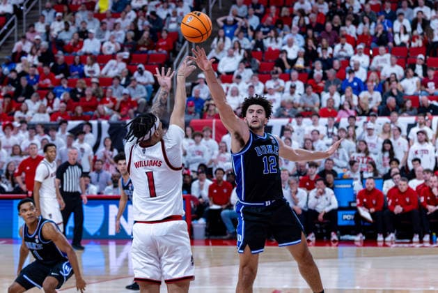 March 2, 2026, Raleigh, North Carolina, USA: NC State Wolfpack forward DARRION WILLIAMS (1) shoots a three pointer over Duke Blue Devils forward CAMERON BOOZER (12) during the second half of the NCAA, College League, USA ACC menÃ¢â‚¬â ¢s basketball game between the Duke Blue Devils and the NC State Wolfpack at the Lenovo Center in Raleigh, North Carolina. Raleigh USA - ZUMAa220 20260302_znp_a220_041 Copyright: xIsraelxAntax