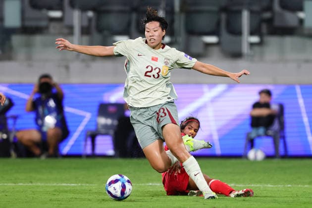 Shao Ziqin of China is tackled by Mosamamt Akther of Bangladesh during the AFC Womens Asian Cup 2026 match between China PR Women and Bangladesh Women at Western Sydney Stadium, Sydney, Australia on 3 March 2026. Copyright: xPeterxDovganx 44610087