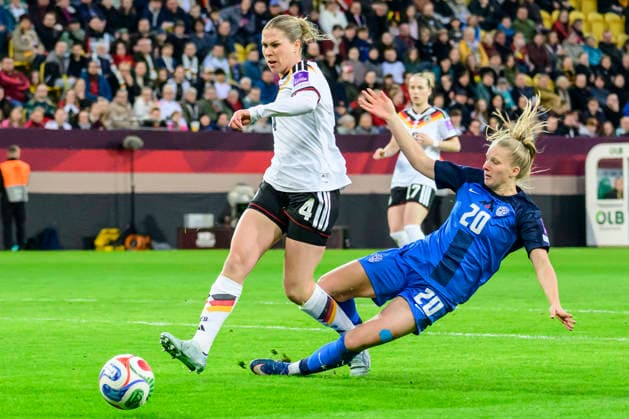In the picture, from left: Camilla Kuever (Germany), Zara Kramžar, Action, duels, fighting for the ball, GER, Dresden, World Cup Qualification, Women, Germany vs Slovenia, at Rudolf-Harbig Stadium Dresden, League A, Group A4, soccer, DFB, league phase, match day 1, DFB DFL REGULATIONS PROHIBIT ANY USE OF PHOTOGRAPHS AS IMAGE SEQUENCES AND OR QUASI-VIDEO, March 3, 2026 Copyright: HMBxMedia UwexKoch