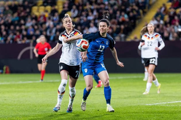 DRESDEN, GERMANY - MARCH 3: Giulia Gwinn (Germany, 7) and Zala Kustrin (Slovenia, 13) battle for the ball during the Women s European Qualifiers for the 2027 FIFA Women s World Cup match between Women s European Qualifiers for the 2027 FIFA Women s World Cup: Germany vs Slovenia at Ulrich-Haberland-Stadion on matchday 1 of the Women s European Qualifiers for the 2027 FIFA Women s World Cup on March 3, 2026 in Dresden, Germany. Saxony Germany Copyright: xSteffiexWunderlx