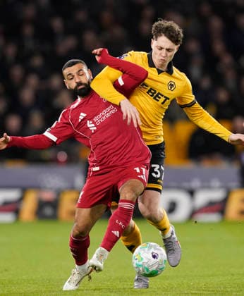 Wolverhampton, England, 3rd March 2026. Mohamed Salah of Liverpool tussles with Ladislav Krejci of Wolverhampton Wanderers during the Wolverhampton Wanderers vs Liverpool Premier League match at Molineux, Wolverhampton. Picture credit should read: Andrew Yates Sportimage EDITORIAL USE ONLY. No use with unauthorised audio, video, data, fixture lists, club league logos or live services. Online in-match use limited to 120 images, no video emulation. No use in betting, games or single club league player publications. SPI_033_AY_Wolves_Liverpool SPI-4574-0030