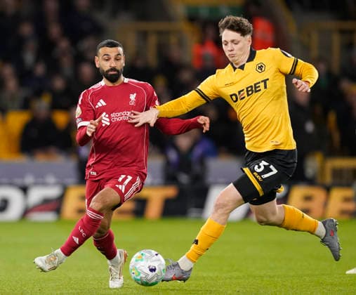 Wolverhampton, England, 3rd March 2026. Mohamed Salah of Liverpool tussles with Ladislav Krejci of Wolverhampton Wanderers during the Wolverhampton Wanderers vs Liverpool Premier League match at Molineux, Wolverhampton. Picture credit should read: Andrew Yates Sportimage EDITORIAL USE ONLY. No use with unauthorised audio, video, data, fixture lists, club league logos or live services. Online in-match use limited to 120 images, no video emulation. No use in betting, games or single club league player publications. SPI_035_AY_Wolves_Liverpool SPI-4574-0032