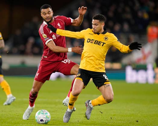 Wolverhampton, England, 3rd March 2026. Cody Gapko of Liverpool tackled Joao Gomes of Wolverhampton Wanderers during the Wolverhampton Wanderers vs Liverpool Premier League match at Molineux, Wolverhampton. Picture credit should read: Andrew Yates Sportimage EDITORIAL USE ONLY. No use with unauthorised audio, video, data, fixture lists, club league logos or live services. Online in-match use limited to 120 images, no video emulation. No use in betting, games or single club league player publications. SPI_043_AY_Wolves_Liverpool SPI-4574-0040