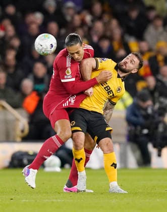 Wolverhampton, England, 3rd March 2026. Virgil van Dijk of Liverpool and Adam Armstrong of Wolverhampton Wanderers during the Wolverhampton Wanderers vs Liverpool Premier League match at Molineux, Wolverhampton. Picture credit should read: Andrew Yates Sportimage EDITORIAL USE ONLY. No use with unauthorised audio, video, data, fixture lists, club league logos or live services. Online in-match use limited to 120 images, no video emulation. No use in betting, games or single club league player publications. SPI_048_AY_Wolves_Liverpool SPI-4574-0046