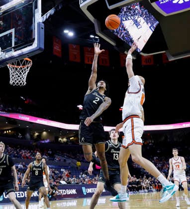 March 03, 2026: Virginia Cavaliers Guard 6 Jacari White shoots over Wake Forest Demon Deacons Guard 2 Jake Harris during a NCAA, College League, USA Men s Basketball game between the Wake Forest Demon Deacons and the University of Virginia Cavaliers at John Paul Jones Arena in Charlottesville, VA. CSM Charlottesville United States of America - ZUMAc04_ 20260303_zma_c04_006 Copyright: xJustinxCooperx