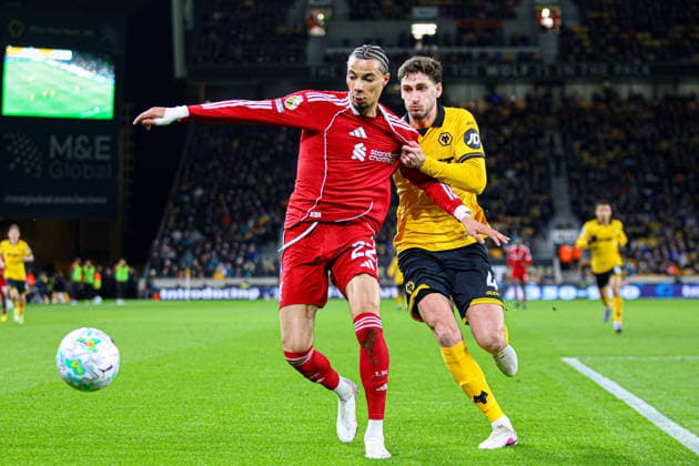 WOLVERHAMPTON, ENGLAND - March 03: Hugo Ekitike of Liverpool holds off Santiago Bueno of Wolves during the Premier League football match between Wolverhampton Wanderers and Liverpool at Molineux stadium on March 03, 2026 in Wolverhampton, England. (Photo by Natalie Mincher Sports Press Photo) Copyright: xNataliexMincher SPPx Sportspressphoto_SPR101103
