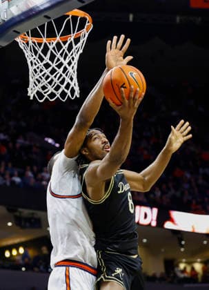 March 03, 2026: Virginia Cavaliers Center 33 Ugonna Onyenso knocks the ball away from Wake Forest Demon Deacons Guard 8 Mekhi Mason during a NCAA, College League, USA Men s Basketball game between the Wake Forest Demon Deacons and the University of Virginia Cavaliers at John Paul Jones Arena in Charlottesville, VA. CSM Charlottesville United States of America - ZUMAc04_ 20260303_zma_c04_037 Copyright: xJustinxCooperx