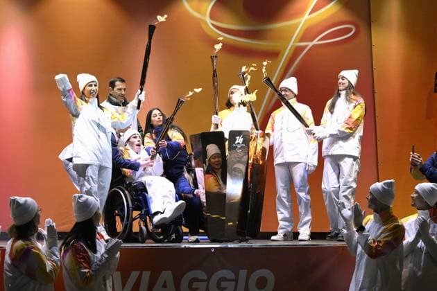 Milan Cortina Paralympics: Torch relay Torchbearers light the cauldron with the Milan Cortina Paralympic flame in Cortina d Ampezzo, Italy, on March 3, 2026.  A14AA0005346190P