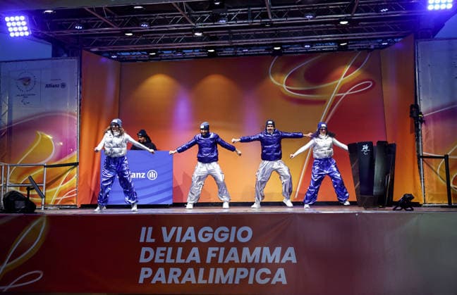 (260304) -- CORTINA D AMPEZZO, March 4, 2026 -- Dancers perform during the Milan-Cortina 2026 Paralympic Winter games, Winterspiele,Spiele, Summer games Torch Relay and Flame Unifying Ceremony in Cortina D Ampezzo, Italy, March 3, 2026. ) (SP)ITALY-CORTINA D AMPEZZO-PARALYMPIC WINTER GAMES-FLAME UNIFYING CEREMONY WangxKaiyan 