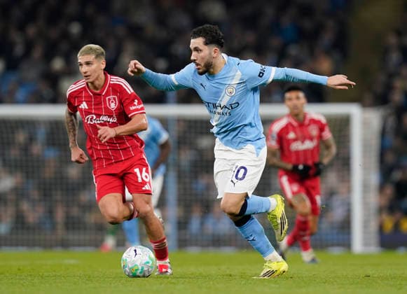 Manchester, England, 4th March 2026. Nicolas Dominguez of Nottingham Forest tracks Rayan Cherki of Manchester City during the Manchester City vs Nottingham Forest Premier League match at the Etihad Stadium, Manchester. Picture credit should read: Andrew Yates Sportimage EDITORIAL USE ONLY. No use with unauthorised audio, video, data, fixture lists, club league logos or live services. Online in-match use limited to 120 images, no video emulation. No use in betting, games or single club league player publications. SPI_035_AY_Manchester_City_Forest SPI-4576-0034