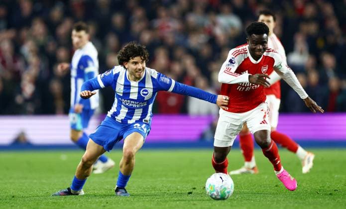 Ferdi Kadioglu of Brighton and Hove Albion and Bukayo Saka of Arsenal. Brighton and Hove Albion v Arsenal, Premier League, Football, American Express Community Stadium, Brighton, UK - 04 Mar 2026Brighton American Express Community Stadi United Kingdom EDITORIAL USE ONLY No use with unauthorised audio, video, data, fixture lists, club league logos or live services. Online in-match use limited to 120 images, no video emulation. No use in betting, games or single club league player publications.  Copyright: xJamesxMarsh Shutterstockx 16720017ak