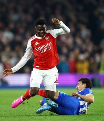 Bukayo Saka of Arsenal is tackled by Olivier Boscagli of Brighton and Hove Albion. Brighton and Hove Albion v Arsenal, Premier League, Football, American Express Community Stadium, Brighton, UK - 04 Mar 2026Brighton American Express Community Stadi United Kingdom EDITORIAL USE ONLY No use with unauthorised audio, video, data, fixture lists, club league logos or live services. Online in-match use limited to 120 images, no video emulation. No use in betting, games or single club league player publications.  Copyright: xJamesxMarsh Shutterstockx 16720017al