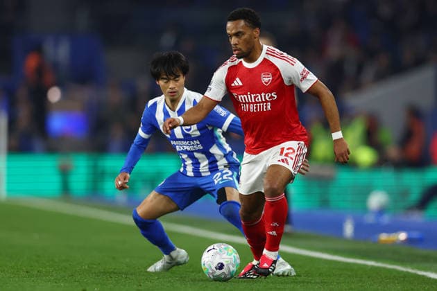 Brighton and Hove, England, 4th March 2026. Jurrien Timber of Arsenal with the ball ahead of Kaoru Mitoma of Brighton and Hove Albion during the Brighton and Hove Albion vs Arsenal Premier League match at the AMEX Stadium, Brighton and Hove. Picture credit should read: Paul Terry Sportimage EDITORIAL USE ONLY. No use with unauthorised audio, video, data, fixture lists, club league logos or live services. Online in-match use limited to 120 images, no video emulation. No use in betting, games or single club league player publications. SPI_017_PT_Brighton_Arsenal SPI-4579-0017