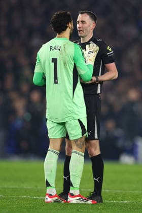 Brighton and Hove, England, 4th March 2026. David Raya of Arsenal talks with Referee Chris Kavanagh during the Brighton and Hove Albion vs Arsenal Premier League match at the AMEX Stadium, Brighton and Hove. Picture credit should read: Paul Terry Sportimage EDITORIAL USE ONLY. No use with unauthorised audio, video, data, fixture lists, club league logos or live services. Online in-match use limited to 120 images, no video emulation. No use in betting, games or single club league player publications. SPI_022_PT_Brighton_Arsenal SPI-4579-0022