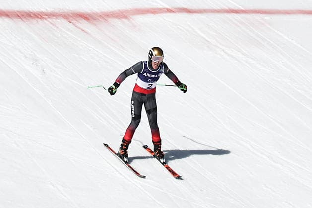 ITALY, VENETO - MARCH 7, 2026: Johannes Aigner of Austria competes in the men s downhill skiing event for visually impaired athletes during the 2026 Winter Paralympic Games on the Olympia delle Tofane of the Tofane Alpine Skiing Centre in Cortina d Ampezzo, Province of Belluno. Mikhail Tereshchenko TASS  89690483