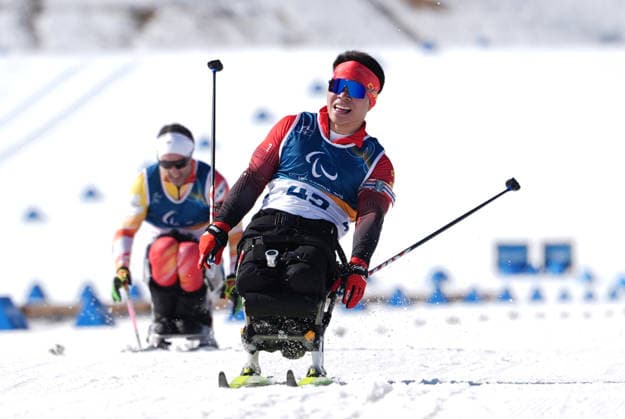 (260307) -- TESERO, March 7, 2026 -- Liu Mengtao (front) of China reacts after the men s sprint sitting final of para biathon at the Milan-Cortina 2026 Paralympic Winter games, Winterspiele,Spiele, Summer games in Tesero, Italy, March 7, 2026. ) (SP)ITALY-TESERO-PARALYMPIC WINTER GAMES-PARA BIATHLON-MEN S SPRINT SITTING HouxZhaokang 