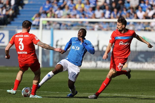 07.03.2026, xtvx, Fussball 2.Bundesliga, SV Darmstadt 98 - Holstein Kiel v.l. Marco Komenda (Holstein Kiel) Merveille Papela (SV Darmstadt 98) (DFL DFB REGULATIONS PROHIBIT ANY USE OF PHOTOGRAPHS as IMAGE SEQUENCES and or QUASI-VIDEO) Darmstadt