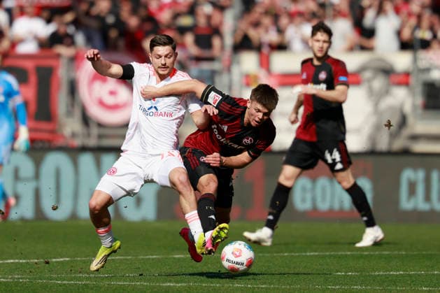v.l.n.r.: Zweikampf zwischen: Florent Muslija (Fortuna Düsseldorf) and Finn Becker (1. FC Nürnberg). Fussball 2. Bundesliga, 1. FC Nürnberg – Fortuna Düsseldorf im Max-Morlock-Stadion, Nürnberg, Deutschland, am 7. März 2026. in action during the 2. Bundesliga match between 1. FC Nürnberg and Fortuna Düsseldorf at the Max-Morlock-Stadion, Nuremberg, Germany, on March 7, 2026 DFL REGULATIONS PROHIBIT ANY USE OF PHOTOGRAPHS AS IMAGE SEQUENCES AND OR QUASI-VIDEO.