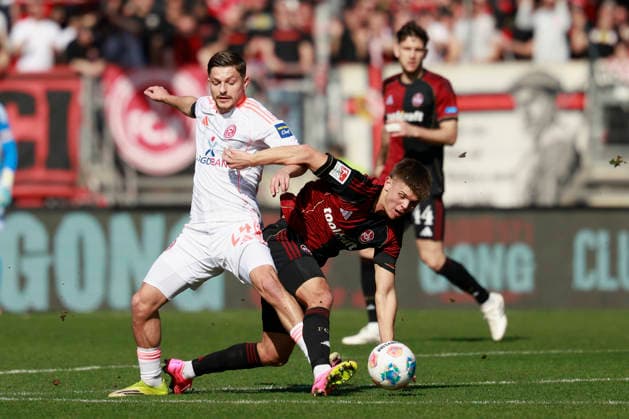v.l.n.r.: Zweikampf zwischen: Florent Muslija (Fortuna Düsseldorf) and Finn Becker (1. FC Nürnberg). Fussball 2. Bundesliga, 1. FC Nürnberg – Fortuna Düsseldorf im Max-Morlock-Stadion, Nürnberg, Deutschland, am 7. März 2026. in action during the 2. Bundesliga match between 1. FC Nürnberg and Fortuna Düsseldorf at the Max-Morlock-Stadion, Nuremberg, Germany, on March 7, 2026 DFL REGULATIONS PROHIBIT ANY USE OF PHOTOGRAPHS AS IMAGE SEQUENCES AND OR QUASI-VIDEO.