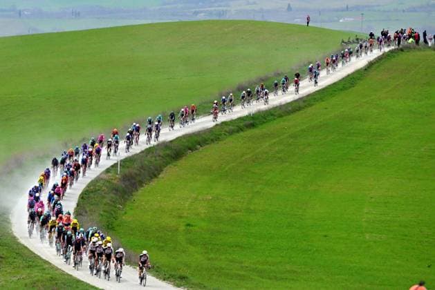 The pack of riders pictured in action during the men elite Strade Bianche one day cycling race, 203km from and to Siena, Italy on Saturday 07 March 2026. DIRKxWAEM  x166734976x