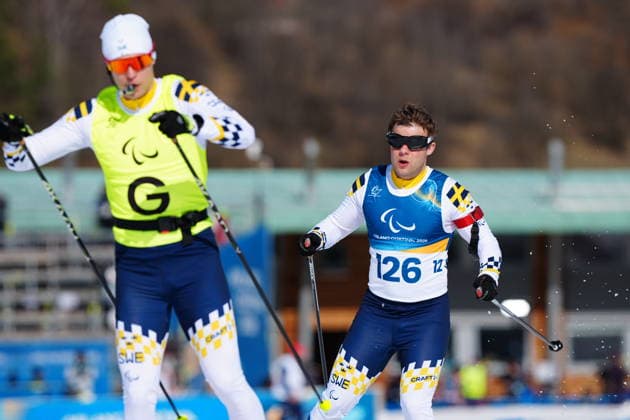 260307 Zebastian Modin of Sweden with guide Emil Talsi competes in men s sprint vision impaired biathlon on March 7, 2026 in Val di Fiemme. Photo: Oscar Olsson Swedish Parasport Federation BILDBYRAN kod XY XY0100 skidskytte biathlon skiskyting 2026 paralympics day 1 para biathlon mens sprint sitting bbeng paralympic games paralympics paralympiska spel paralympiske leker vinter-paralympics winter paralympics milano cortina 2026 milano cortina 2026 winter paralympic games paraskidskytte *** 260307 Zebastian Modin of Sweden with guide Emil Talsi competes in men s sprint vision impaired biathlon on March 7, 2026 in Val di Fiemme Photo Oscar Olsson Swedish Parasport Federation BILDBYRAN code XY XY0100 biathlon biathlon biathlon 2026 paralympics day 1 para biathlon mens sprint sitting bbeng paralympic games paralympiska spel paralympiske leker vinter paralympics winter paralympics milano cortina 2026 milano cortina 2026 winter paralympic games paraskidskytte  Copyright: OscarxOlsson BB260307ZL018