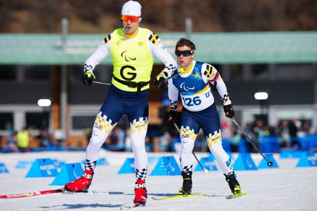 260307 Zebastian Modin of Sweden with guide Emil Talsi competes in men s sprint vision impaired biathlon on March 7, 2026 in Val di Fiemme. Photo: Oscar Olsson Swedish Parasport Federation BILDBYRAN kod XY XY0100 skidskytte biathlon skiskyting 2026 paralympics day 1 para biathlon mens sprint sitting bbeng paralympic games paralympics paralympiska spel paralympiske leker vinter-paralympics winter paralympics milano cortina 2026 milano cortina 2026 winter paralympic games paraskidskytte *** 260307 Zebastian Modin of Sweden with guide Emil Talsi competes in men s sprint vision impaired biathlon on March 7, 2026 in Val di Fiemme Photo Oscar Olsson Swedish Parasport Federation BILDBYRAN code XY XY0100 biathlon biathlon biathlon 2026 paralympics day 1 para biathlon mens sprint sitting bbeng paralympic games paralympiska spel paralympiske leker vinter paralympics winter paralympics milano cortina 2026 milano cortina 2026 winter paralympic games paraskidskytte  Copyright: OscarxOlsson BB260307ZL019