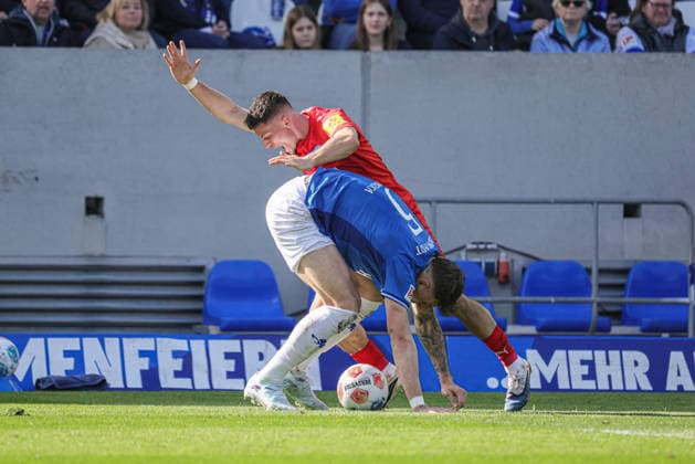 07.03.2026, xhettx, Fussball 2.Bundesliga, SV Darmstadt 98 - Holstein Kiel v.l. Matej Maglica (SV Darmstadt 98, 5) verteidigt den Ball vor 20 (DFL DFB REGULATIONS PROHIBIT ANY USE OF PHOTOGRAPHS as IMAGE SEQUENCES and or QUASI-VIDEO)