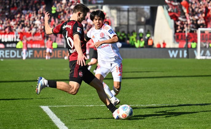 07.03.2026 - Fussball - Saison 2025 2026 - 2. Fussball - Bundesliga - 25. Spieltag: 1. FC Nürnberg FCN ( Club ) - Fortuna Düsseldorf F95 - Sportfoto Zink - xwoxzix - DFL regulations prohibit any use of photographs as image sequences and or quasi-video - only for editorial use - Adam Markhiev (6, 1. FC Nürnberg FCN ) Satoshi Tanaka (16, Fortuna Düsseldorf F95 )