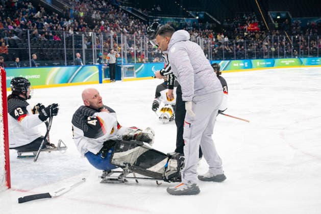 Para Ice hockey, Eishockey - Millano Cortina 2026 Winter Paralympics: Day 1 Para Ice Hockey - Milano Cortina 2026 Winter Paralympics: Day 1 MILANO SANTAGIULIA ICE HOCKEY ARENA MILANO, ITALY - MARCH 7: Preliminary Round - Group A China - Germany KUNST Simon (No. 47, Athlet, Goalkeeper, 03.08.1986, Club Hannover Ice Lions) gets injured. SENOUSSI Kaba (Staff, Medical Doctor) is talking to his athlete. Team Para Ice Hockey Germany is playing China on March 7 at the Milano Santagiulia Ice Hockey Arena at day 1 of the Milano Cortina 2026 Winter Paralympics. (Photo by RALF KUCKUCK) Copyright 2026 Ralf Kuckuck