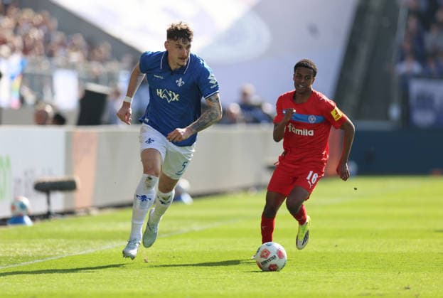 07.03.2026, Fussball 2. Bundesliga, SV Darmstadt 98 - Holstein Kiel, emonline, emspor, despor, v.l., Matej Maglica (SV Darmstadt 98), Andu Yobel Kelati (Holstein Kiel) DFL DFB REGULATIONS PROHIBIT ANY USE OF PHOTOGRAPHS AS IMAGE SEQUENCES AND OR QUASI-VIDEO. xdcx