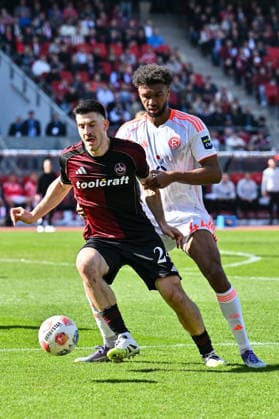 2. Bundesliga; 1. FC Nuremberg- Fortuna Düsseldorf; 07.03.2026 NUREMBERG, GERMANY - 07. MARCH: im Duell Elias EGOULI (Fortuna Düsseldorf 44) und Luka LOCHOSHVILI (1. FC Nuernberg 24) während dem Match zwischen dem 1. FC Nürnberg und Fortuna Düsseldorf am 25. Spieltag der 2. Bundesliga im Max Morlock Stadion DFL REGULATIONS PROHIBIT ANY USE OF PHOTOGRAPHS AS IMAGE SEQUENCES AND OR QUASI-VIDEO