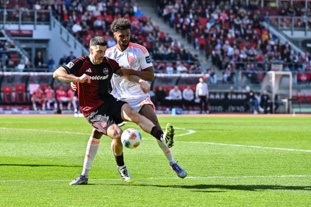 2. Bundesliga; 1. FC Nuremberg- Fortuna Düsseldorf; 07.03.2026 NUREMBERG, GERMANY - 07. MARCH: im Duell Elias EGOULI (Fortuna Düsseldorf 44) und Luka LOCHOSHVILI (1. FC Nuernberg 24) während dem Match zwischen dem 1. FC Nürnberg und Fortuna Düsseldorf am 25. Spieltag der 2. Bundesliga im Max Morlock Stadion DFL REGULATIONS PROHIBIT ANY USE OF PHOTOGRAPHS AS IMAGE SEQUENCES AND OR QUASI-VIDEO