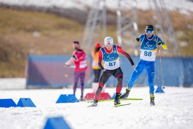 (260307) -- TESERO, March 7, 2026 -- Liu Xiaobin (L) of China competes during the men s sprint standing final of para biathon at the Milan-Cortina 2026 Paralympic Winter games, Winterspiele,Spiele, Summer games in Tesero, Italy, March 7, 2026. ) (SP)ITALY-TESERO-PARALYMPIC WINTER GAMES-PARA BIATHLON-MEN S SPRINT STANDING LianxZhen 
