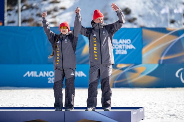 TESERO, ITALY - MARCH 07: Leonie WALTER of Germany, classification NS2, born Jan 2004 in Freiburg, local club SC St. Peter, regional association Baden-Wuerttemberg and her guide Christian KRASMAN of Germany born May 2001 in Stuehlingen, local club Ski-Club Schoenwald, regional association Baden-Wuerttemberg at the podium during the nordic ski competitions for the bronze medal in the visually impaired women s para biathlon sprint finals over 7.5km on day 1 of the Paralympic Winter games, Winterspiele,Spiele, Summer games Milano Cortina 2026 at Cross-Country Skiing Stadium (TCC) of Tesero on 07.3.2026 in Trento Val di Fiemme Italy. Photo Oliver Kremer Pixolli Studios silver medalist Carina ELDINGEROVA (CZE), gold medalist YUE CHIN WANG (CHN) Trento Val di Fiemme Italy Copyright: xOliverxKremerx