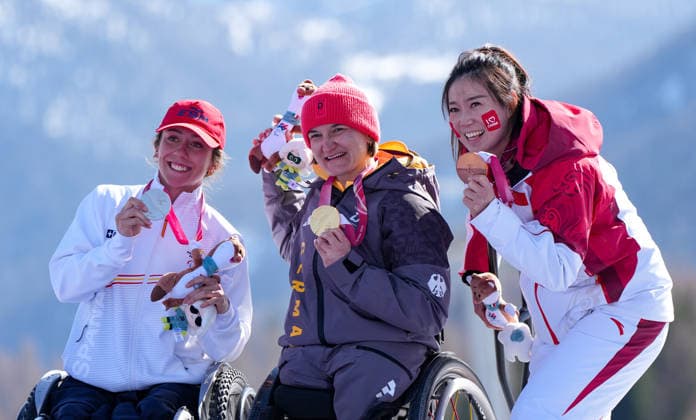(260307) -- CORTINA D AMPEZZO, March 7, 2026 -- Anna-Lena Forster (C) of Germany, Audrey Pascual Seco (L) of Spain, Liu Sitong of China celebrate during awarding ceremony for the para alpine skiing women s downhill sitting match at the Milan-Cortina 2026 Paralympic Winter games, Winterspiele,Spiele, Summer games in Cortina D ampezzo, Italy, March 7, 2026. ) (SP)ITALY-CORTINA D AMPEZZO-PARALYMPIC WINTER GAMES-PARA ALPINE SKIING-WOMEN S DOWNHILL-SITTING WangxKaiyan 
