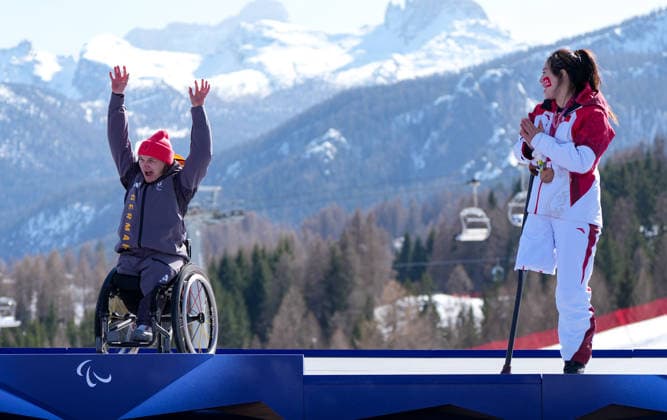(260307) -- CORTINA D AMPEZZO, March 7, 2026 -- Liu Sitong (R) of China congratulates Anna-Lena Forster of Germany during awarding ceremony for the para alpine skiing women s downhill sitting match at the Milan-Cortina 2026 Paralympic Winter games, Winterspiele,Spiele, Summer games in Cortina D ampezzo, Italy, March 7, 2026. ) (SP)ITALY-CORTINA D AMPEZZO-PARALYMPIC WINTER GAMES-PARA ALPINE SKIING-WOMEN S DOWNHILL-SITTING WangxKaiyan 