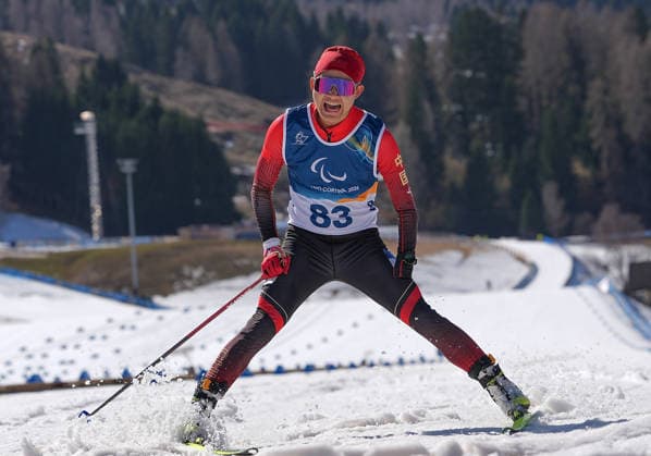 (260308) -- TESERO, March 8, 2026 -- Cai Jiayun of China crosses the finish line during the para biathlon men s sprint at the Milan-Cortina 2026 Paralympic Winter games, Winterspiele,Spiele, Summer games in Tesero, Italy, March 7, 2026. ) (SP)ITALY-TESERO-PARALYMPIC WINTER GAMES-PARA BIATHLON-MEN S SPRINT STANDING HouxZhaokang 