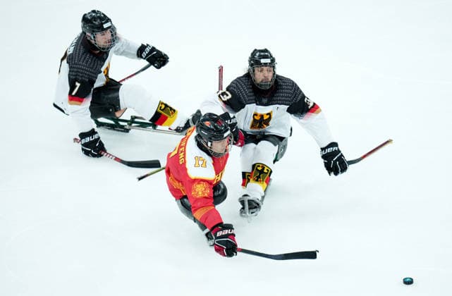 (260308) -- MILAN, March 8, 2026 -- China s Shen Yifeng (C) vies with Germany s Ingo Kuhli-Lauenstein (R) and Leopold Reimann during the Para Ice hockey, Eishockey preliminary round Group A match between China and Germany at the Milan-Cortina 2026 Paralympic Winter games, Winterspiele,Spiele, Summer games in Milan, Italy, March 7, 2026. ) (SP)ITALY-MILAN-PARALYMPIC WINTER GAMES-PARA ICE HOCKEY-CHINA VS GERMANY LixJing 