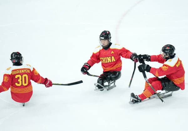 (260308) -- MILAN, March 8, 2026 -- Players of China celebrate a goal during the Para Ice hockey, Eishockey preliminary round Group A match between China and Germany at the Milan-Cortina 2026 Paralympic Winter games, Winterspiele,Spiele, Summer games in Milan, Italy, March 7, 2026. ) (SP)ITALY-MILAN-PARALYMPIC WINTER GAMES-PARA ICE HOCKEY-CHINA VS GERMANY LixJing 